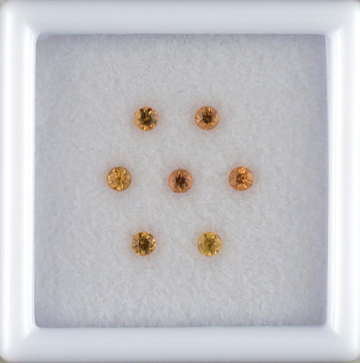 0.27twt Orange Sapphire Melee Parcel Top View White Background