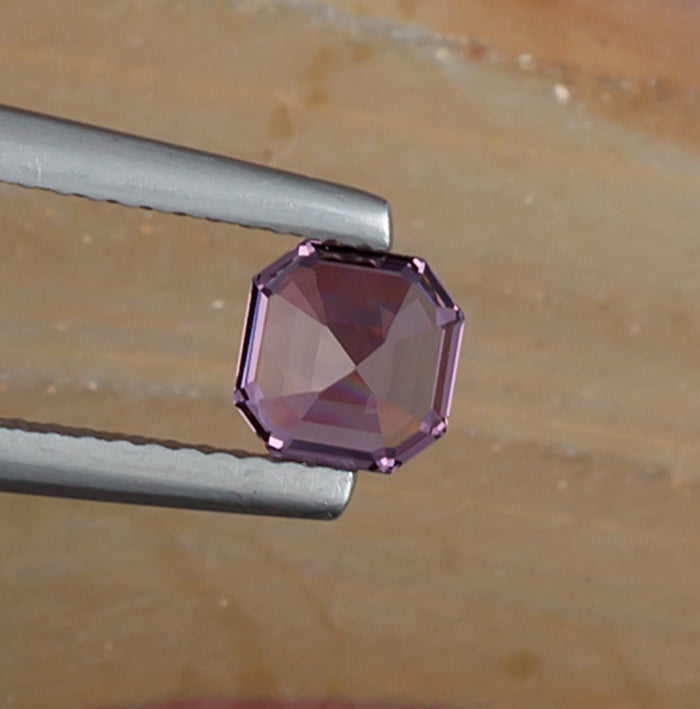 0.93ct Lavender Spinel Colored Gemstone Bottom View Natural Background