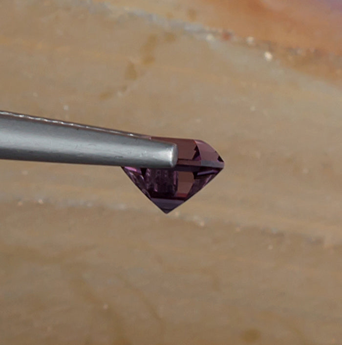 0.93ct Lavender Spinel Colored Gemstone Side View Natural Background