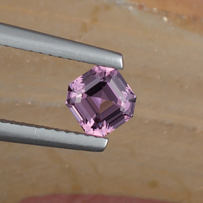 0.93ct Lavender Spinel Colored Gemstone Top View Natural Background