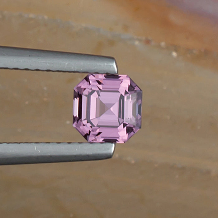 0.93ct Lavender Spinel Colored Gemstone Top View Natural Background