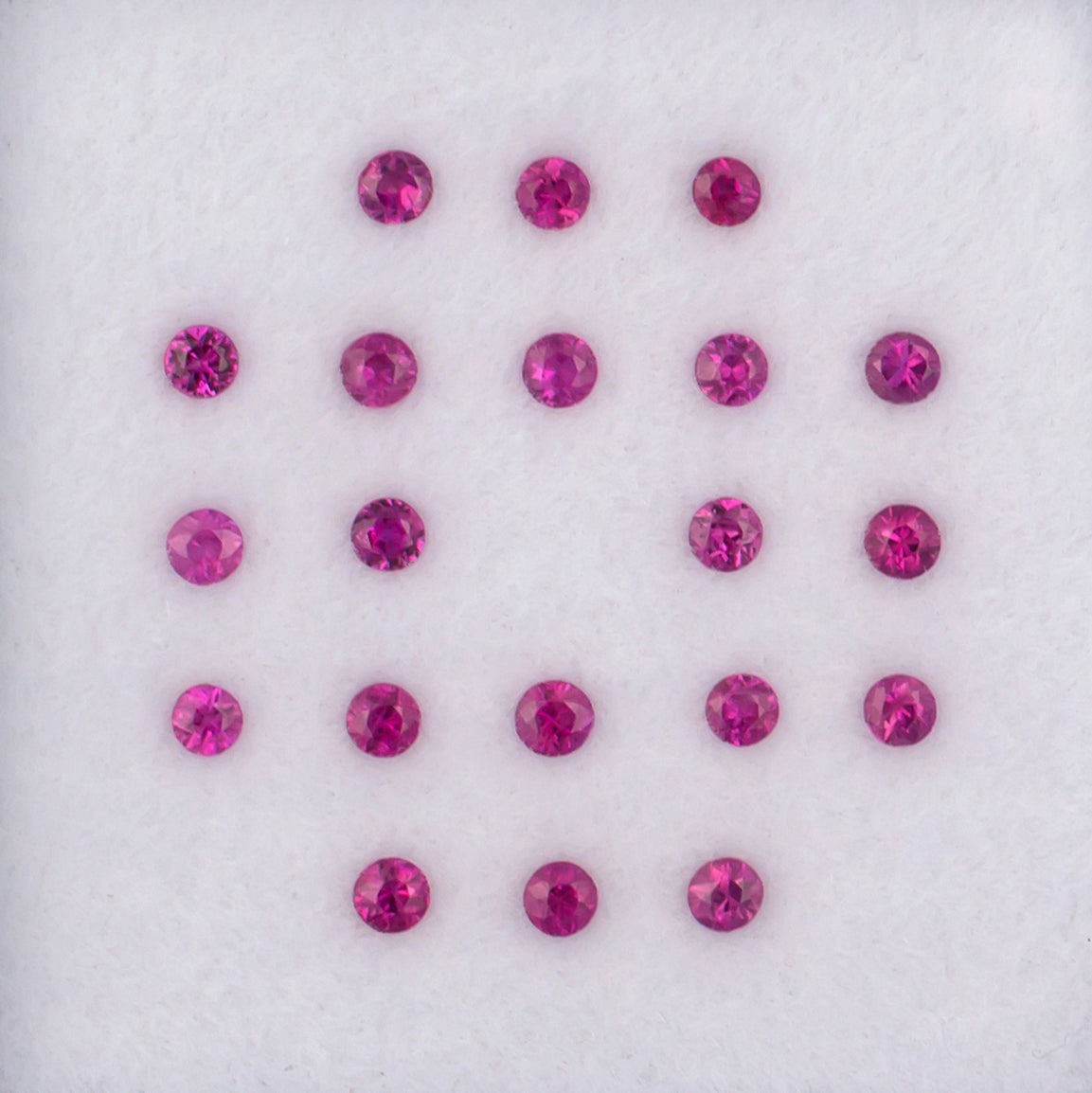 0.94twt Mogok Ruby Colored Gemstone Melee Parcel Top View White Background