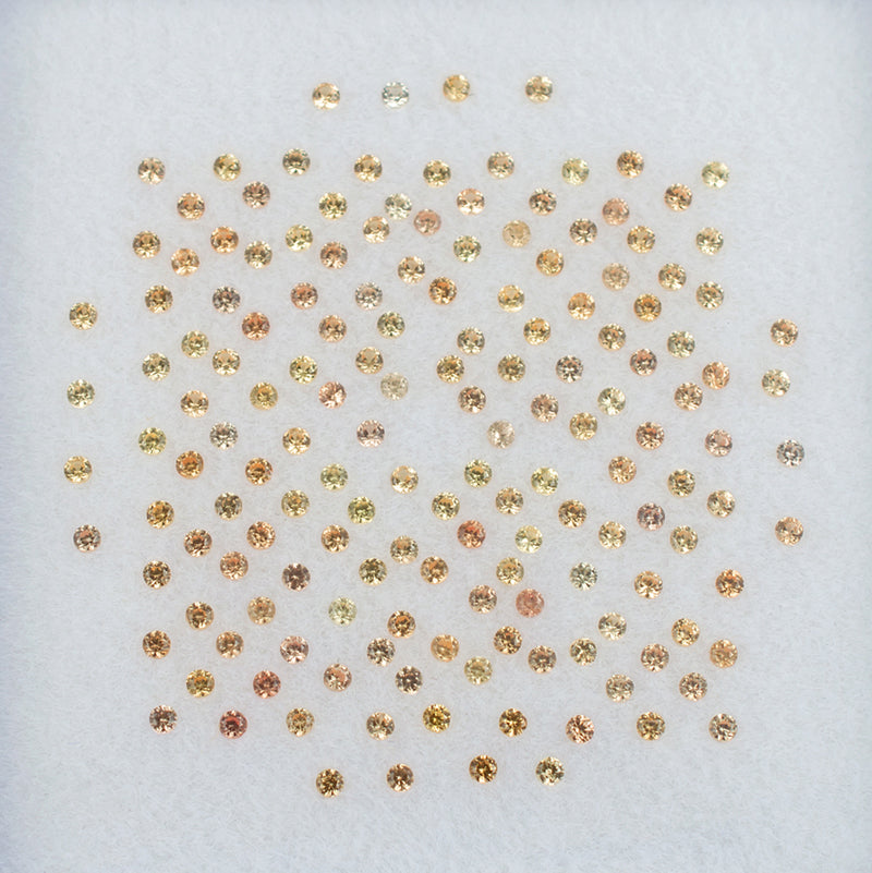 1.00mm Orange Sapphire Colored Gemstone Melee Parcel Top View White Background