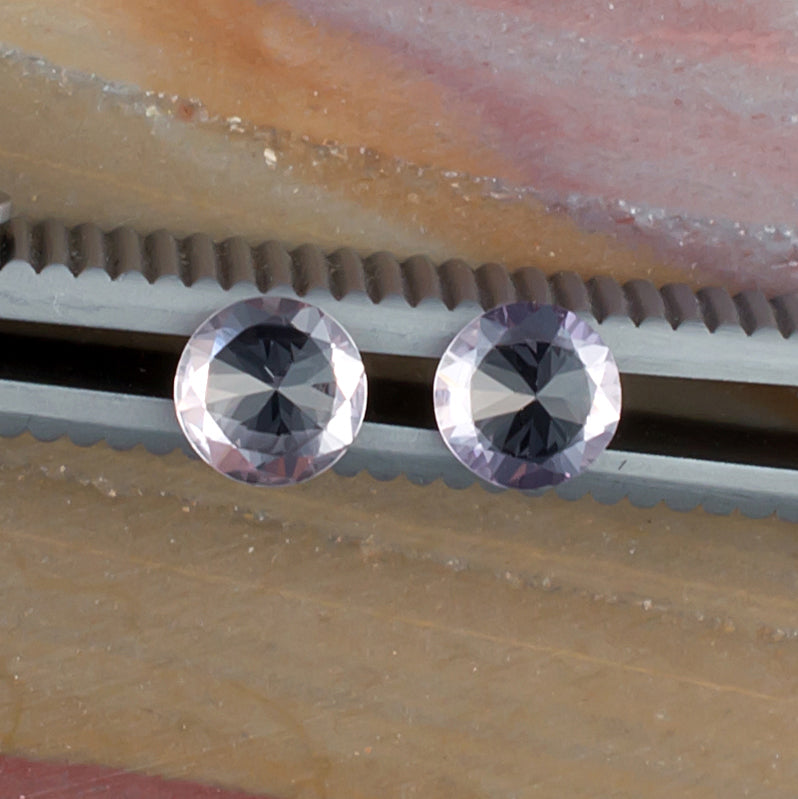 1.01twt Pink Sapphire Colored Gemstone Pair Bottom View Natural Background