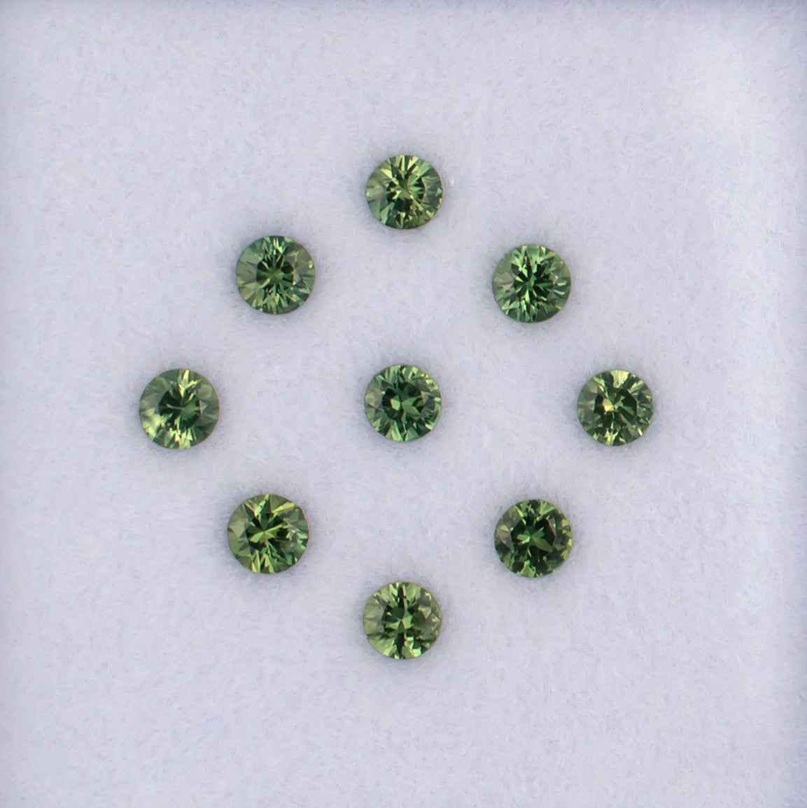 1.23twt Green Sapphire Colored Gemstone Melee Parcel Top View White Background