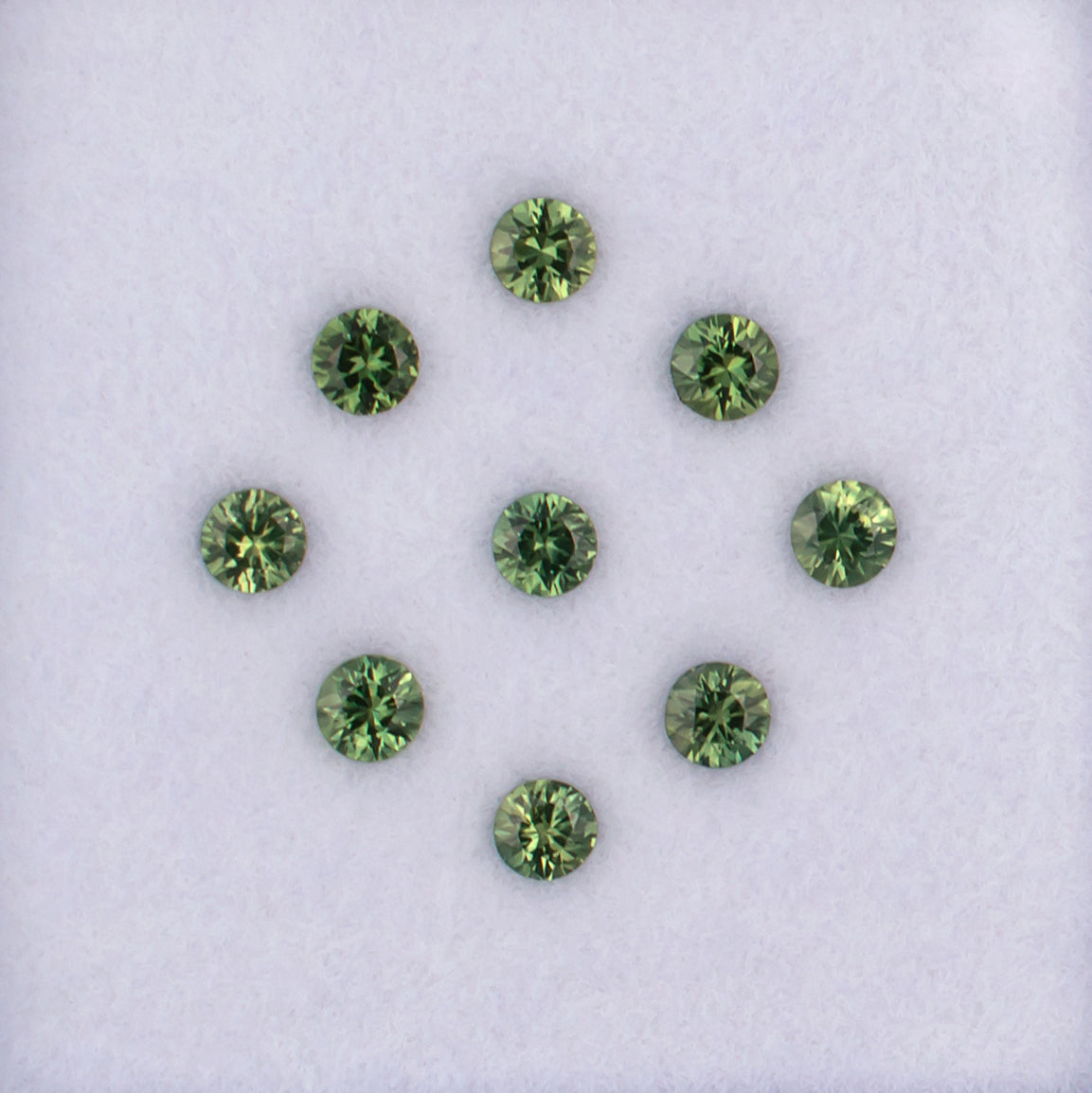 1.23twt Green Sapphire Colored Gemstone Melee Parcel Top View White Background