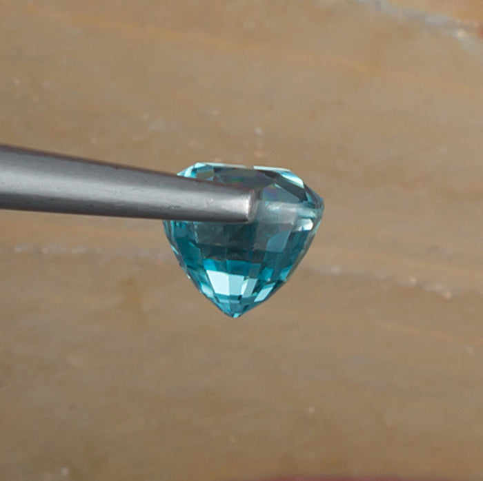 1.67ct Blue Zircon Colored Gemstone Side View Natural Background