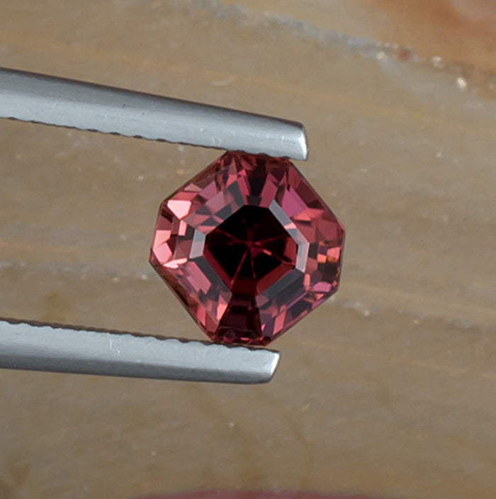 1.67ct Red Pink Tourmaline Colored Gemstone Top View Angle Natural Background