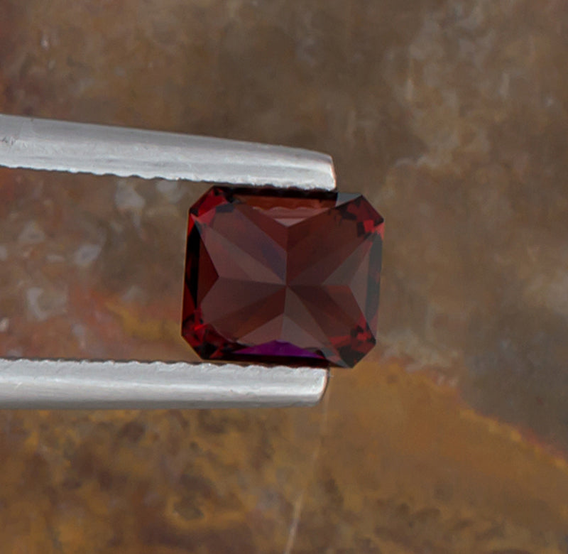 1.92ct Malaya Garnet Colored Gemstone Bottom View Natural Background
