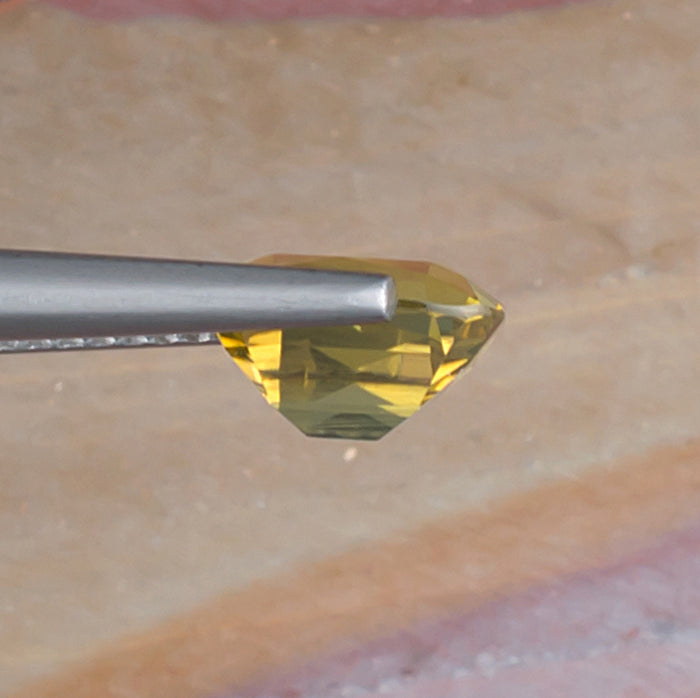 2.45ct Yellow Zircon Colored Gemstone Side View Natural Background