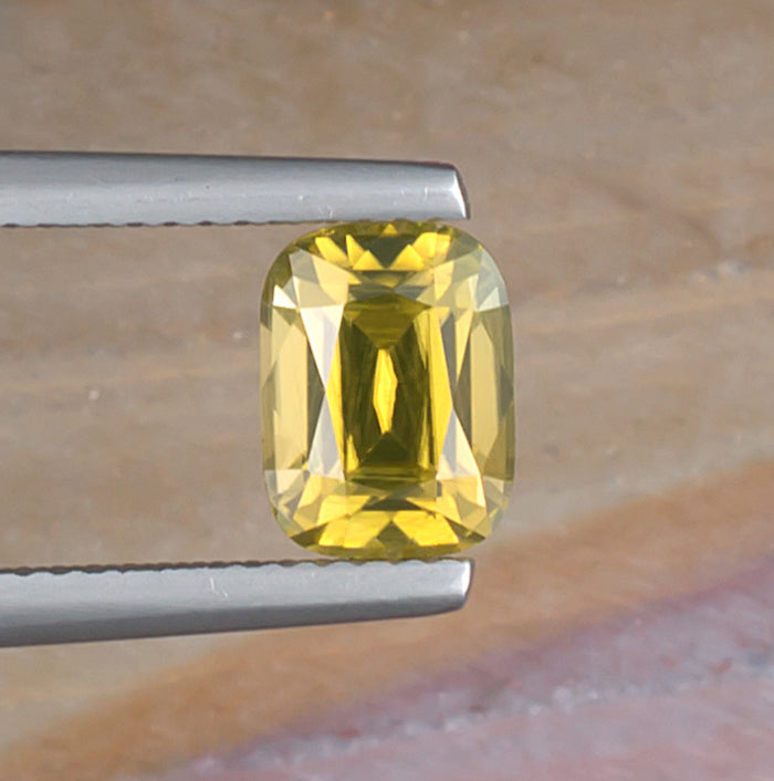 2.45ct Yellow Zircon Colored Gemstone Top View Natural Background