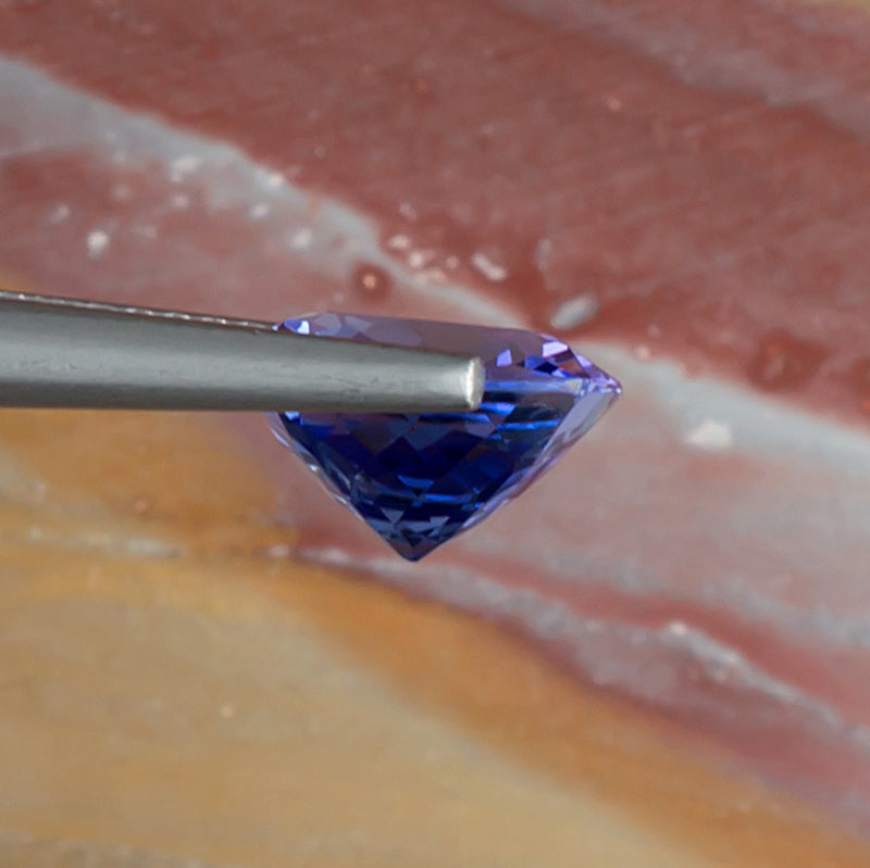 3.08ct Tanzanite Colored Gemstone Side View Natural Background