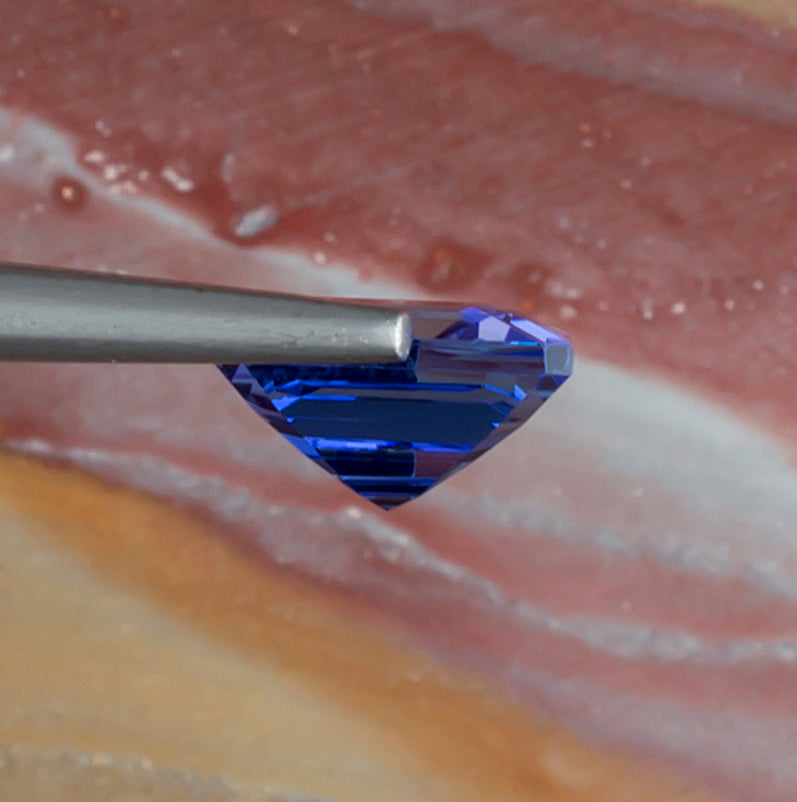 3.39ct Tanzanite Colored Gemstone Side View Natural Background