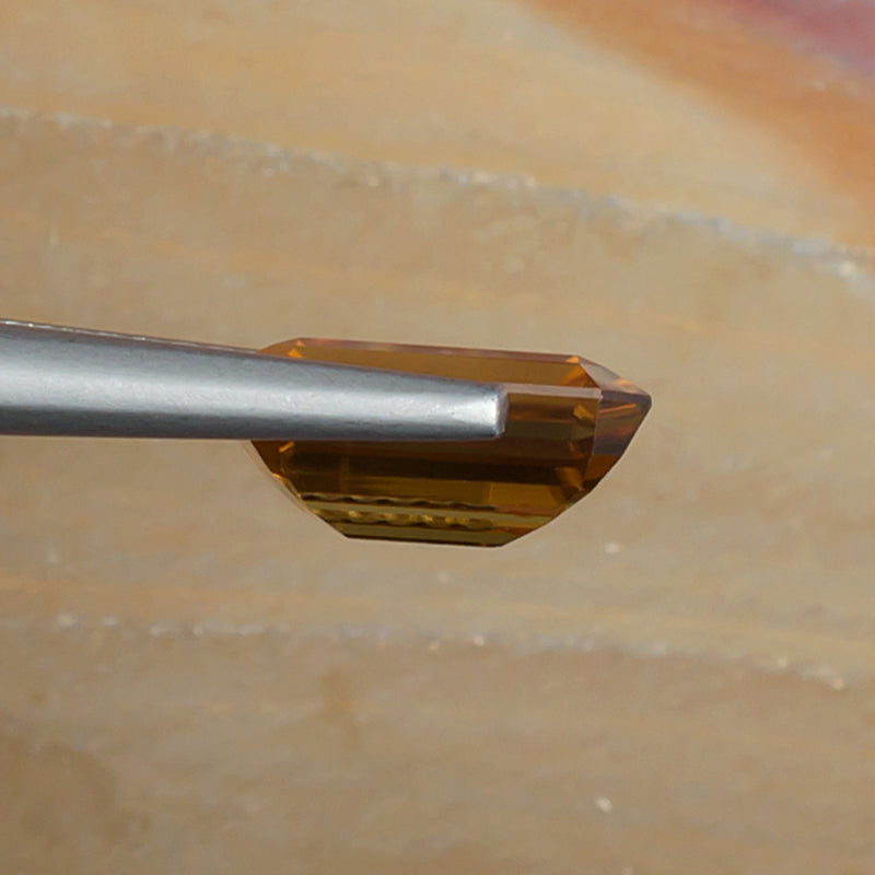 3.73ct Yellow Zircon Colored Gemstone Side View Natural Background