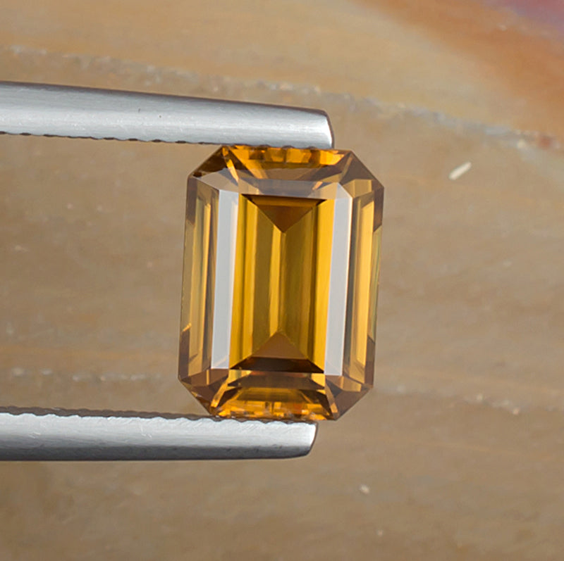 3.73ct Yellow Zircon Colored Gemstone Top View Natural Background