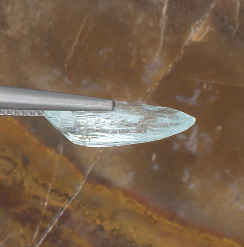 3.84ct Aquamarine Colored Gemstone Side View Natural Background