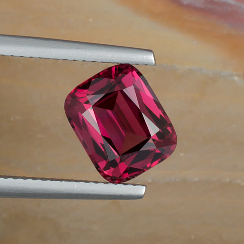3.94ct Rhodolite Garnet Colored Gemstone Top View Natural Background