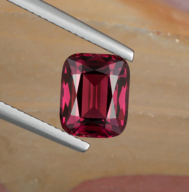 3.94ct Rhodolite Garnet Colored Gemstone Top View Natural Background