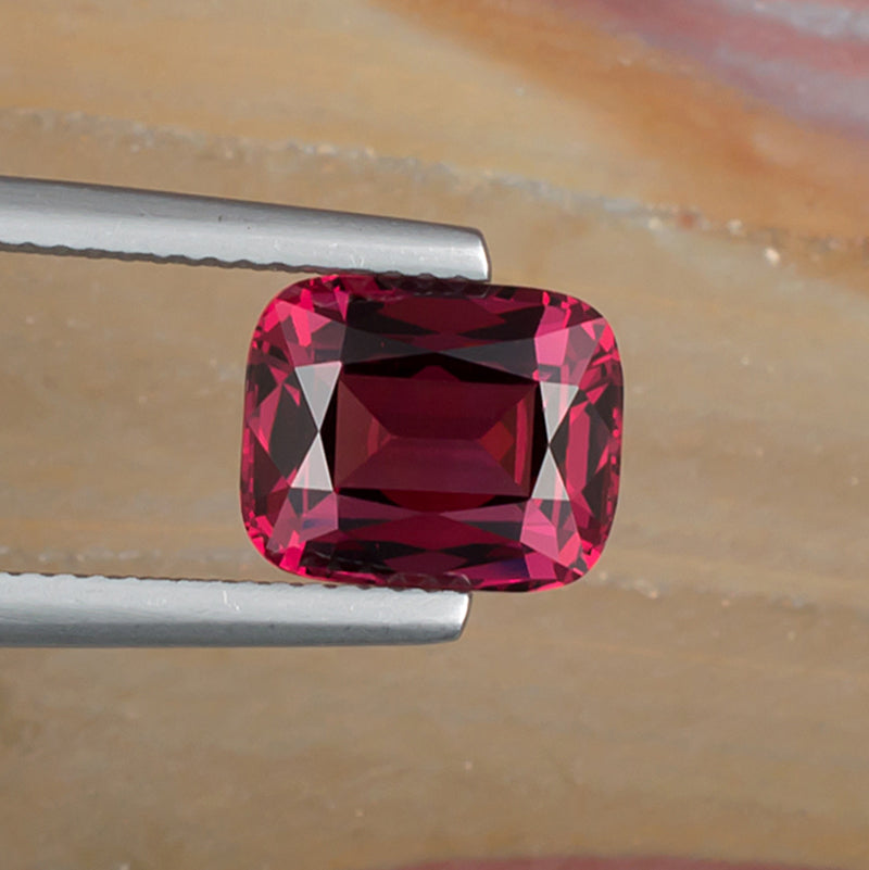 3.94ct Rhodolite Garnet Colored Gemstone Top View Natural Background
