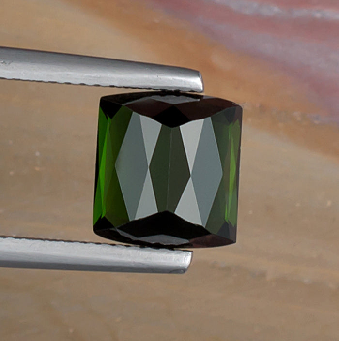 3.99ct Green Tourmaline Colored Gemstone Bottom View Natural Background