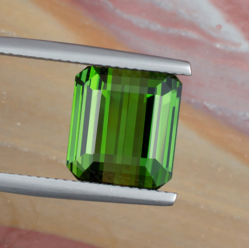 8.93ct Green Tourmaline Colored Gemstone Top View Natural Background