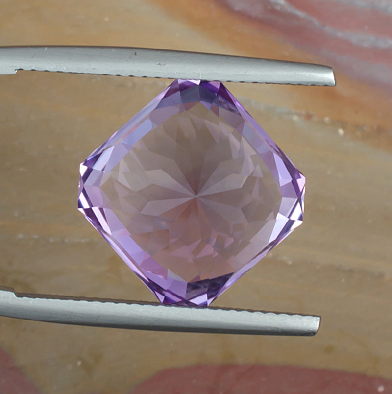 9.73ct Amethyst Colored Gemstone Bottom View Natural Background