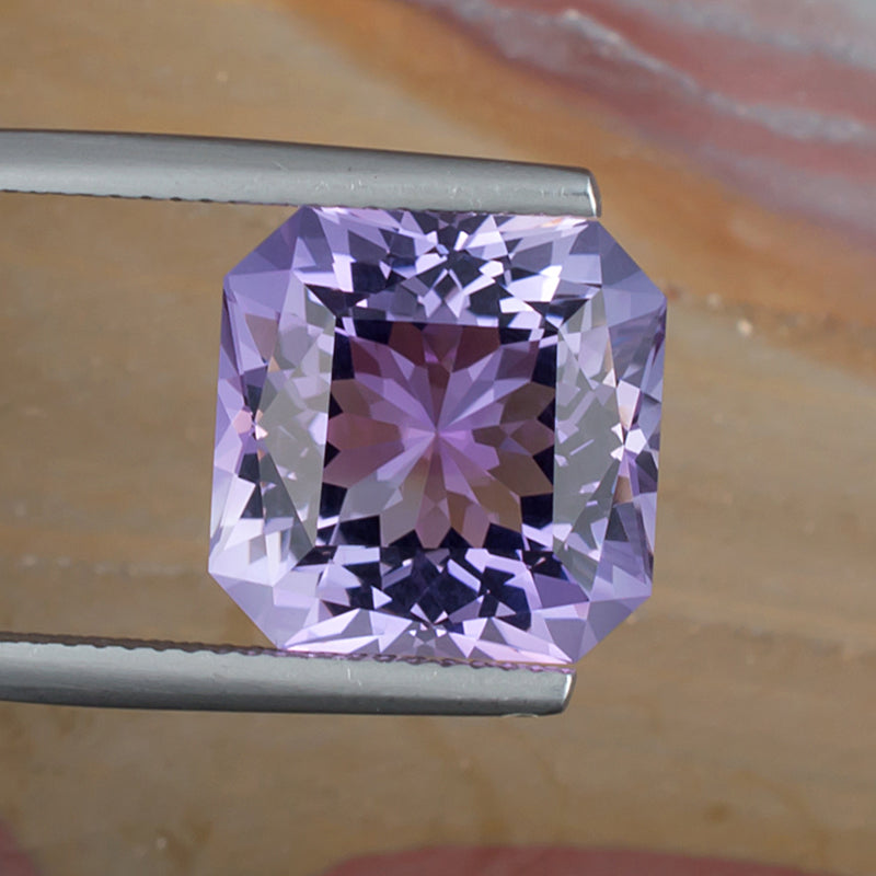 9.73ct Amethyst Colored Gemstone Top View Natural Background