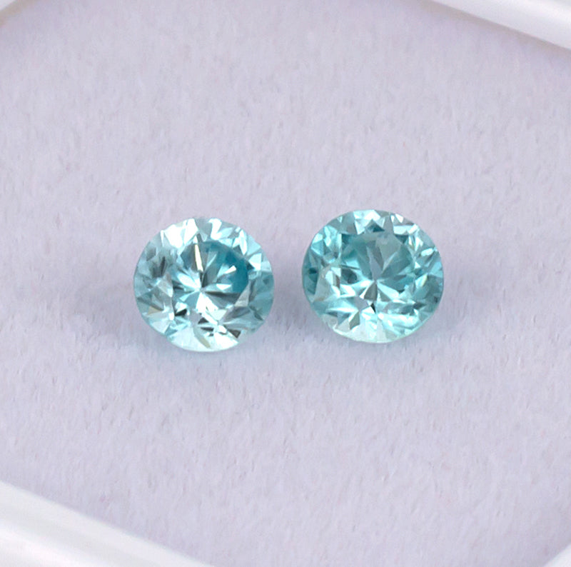 Blue Zircon Colored Gemstone Pair Top View White Background