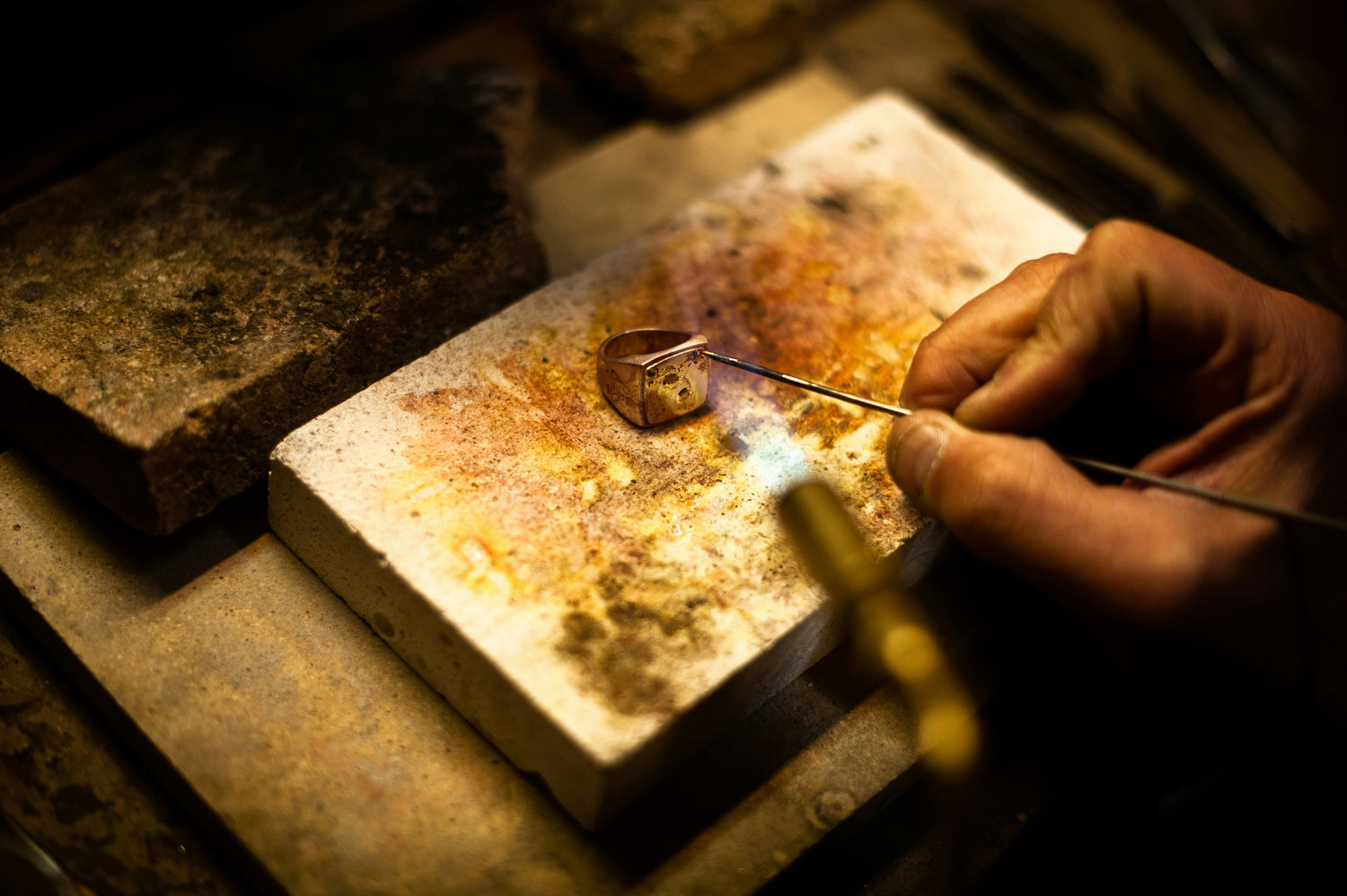 Jeweler Working on a Handmade Gold Ring at a Jewelers Bench