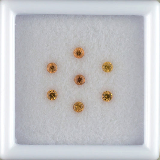 0.27twt Orange Sapphire Melee Parcel Top View White Background 
