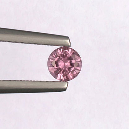 0.41ct Malaya Garnet Colored Gemstone Top View White Background
