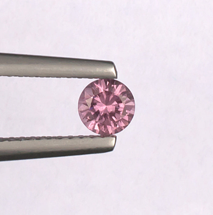 0.41ct Malaya Garnet Colored Gemstone Top View White Background
