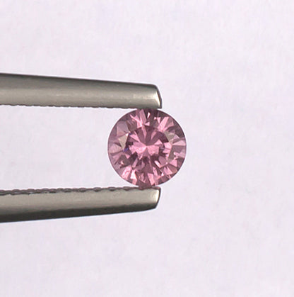 0.41ct Malaya Garnet Colored Gemstone Top View White Background
