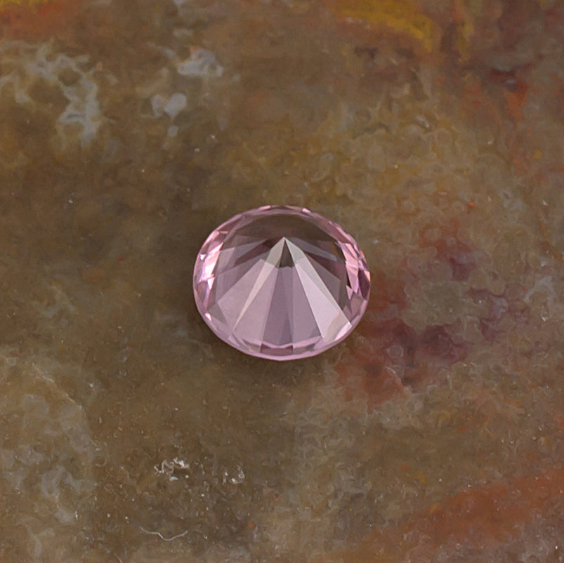 0.59 Malaya Garnet Colored Gemstone Front View Natural Background
