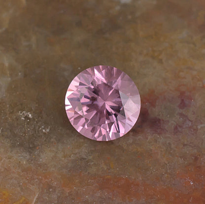0.59 Malaya Garnet Colored Gemstone Front View Natural Background
