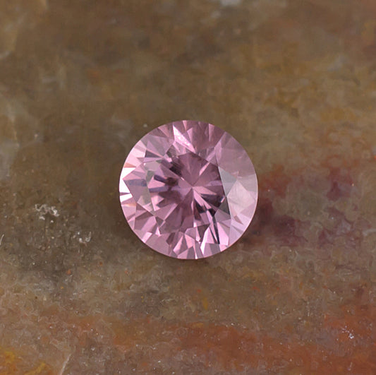 0.59 Malaya Garnet Colored Gemstone Front View Natural Background
