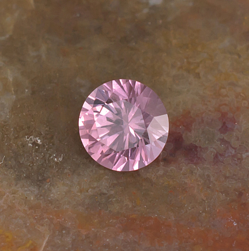 0.59 Malaya Garnet Colored Gemstone Front View Natural Background
