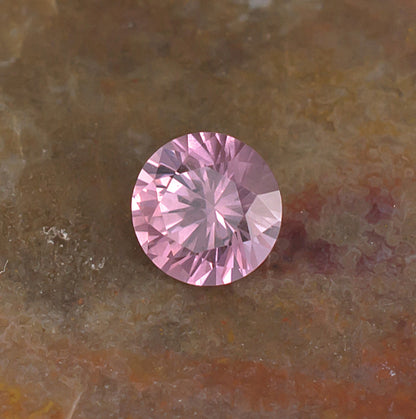 0.59 Malaya Garnet Colored Gemstone Front View Natural Background
