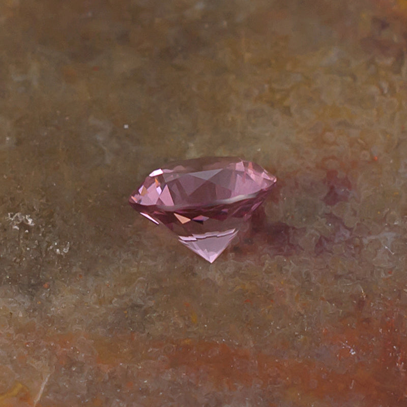 0.59 Malaya Garnet Colored Gemstone Front View Natural Background

