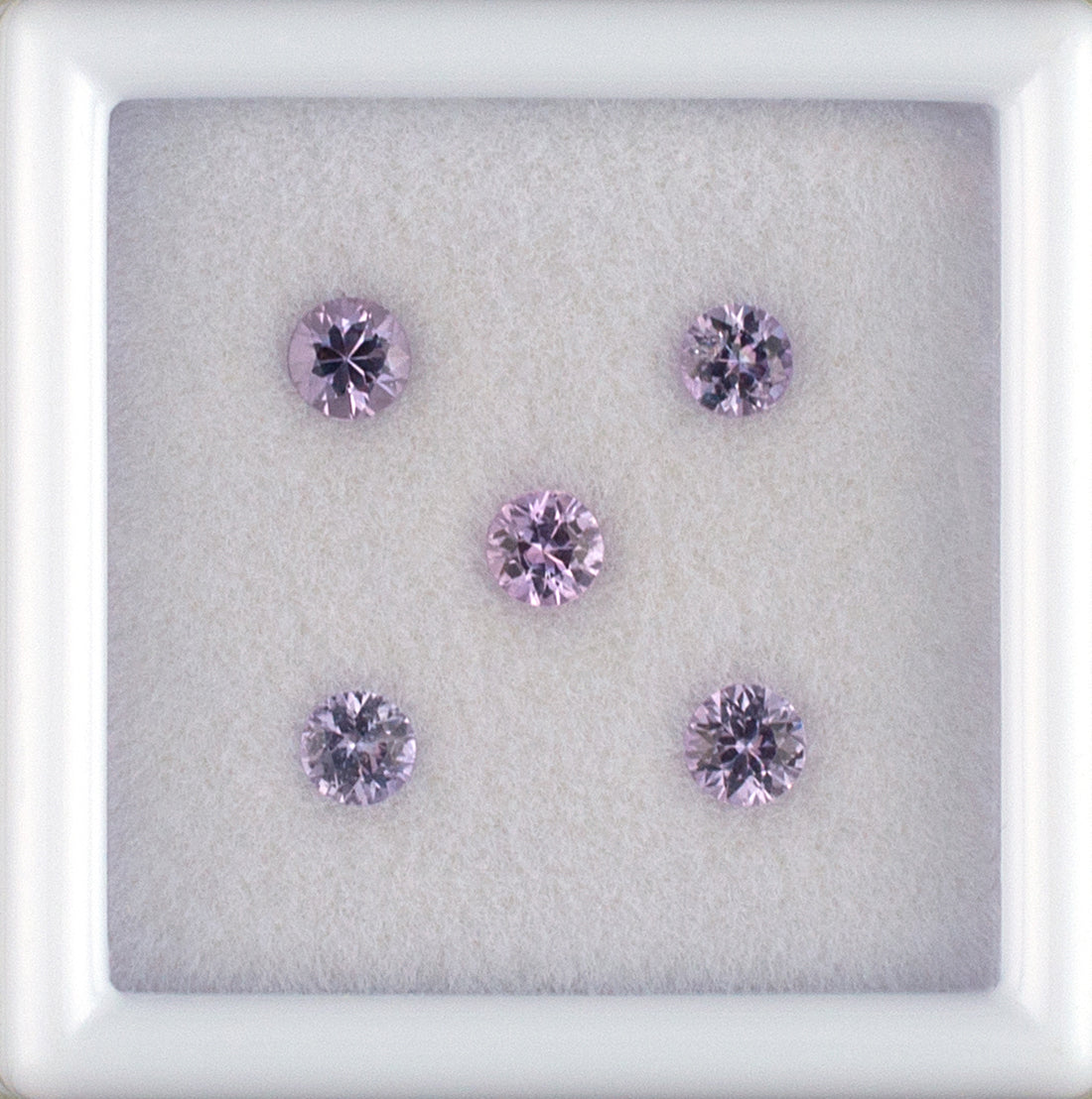 0.64twt Pink Sapphire Colored Gemstone Melee Parcel Top View White Background 
