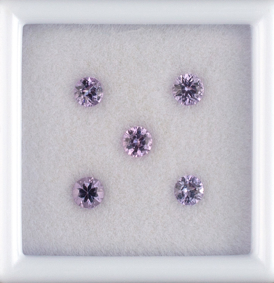 0.64twt Pink Sapphire Colored Gemstone Melee Parcel Top View White Background 
