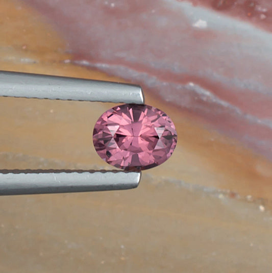 0.77ct Pink Spinel Colored Gemstone Top View Natural Background 
