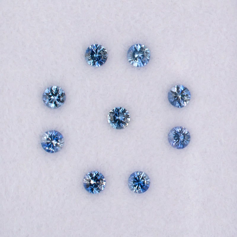0.82twt Blue Sapphire Colored Gemstone Melee Parcel Top View White Background
