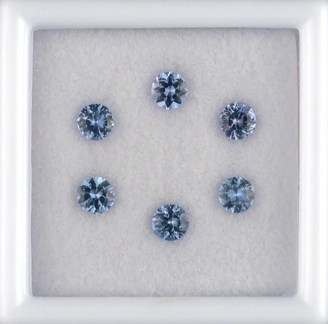 0.85twt Blue Sapphire Colored Gemstone Melee Parcel Top View White Background 
