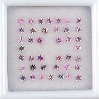 0.90twt Pink Sapphire Colored Gemstone Melee Parcel Top View White Background 
