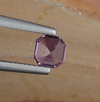 0.93ct Lavender Spinel Colored Gemstone Bottom View Natural Background 
