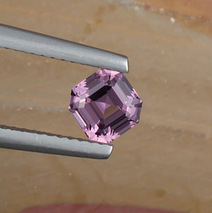 0.93ct Lavender Spinel Colored Gemstone Top View Natural Background 
