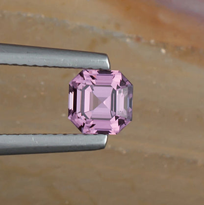 0.93ct Lavender Spinel Colored Gemstone Top View Natural Background
