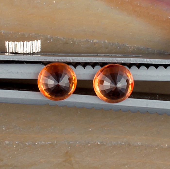 0.93twt Orange Sapphire Colored Gemstone Pair Bottom View Natural Background 
