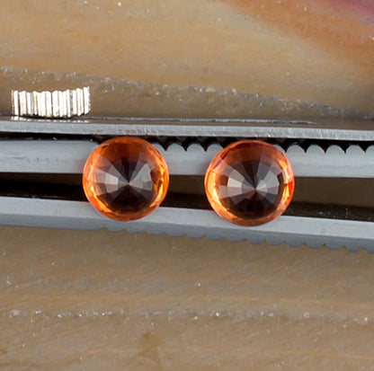 0.93twt Orange Sapphire Colored Gemstone Pair Bottom View Natural Background 
